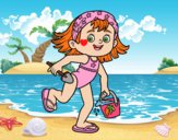 Little girl with beach bucket and spade