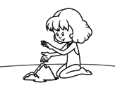 Girl making a sand castle coloring page